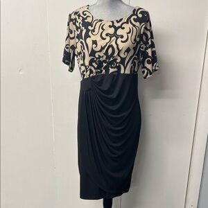 Pretty black and cream knit dress with nice draping details.
